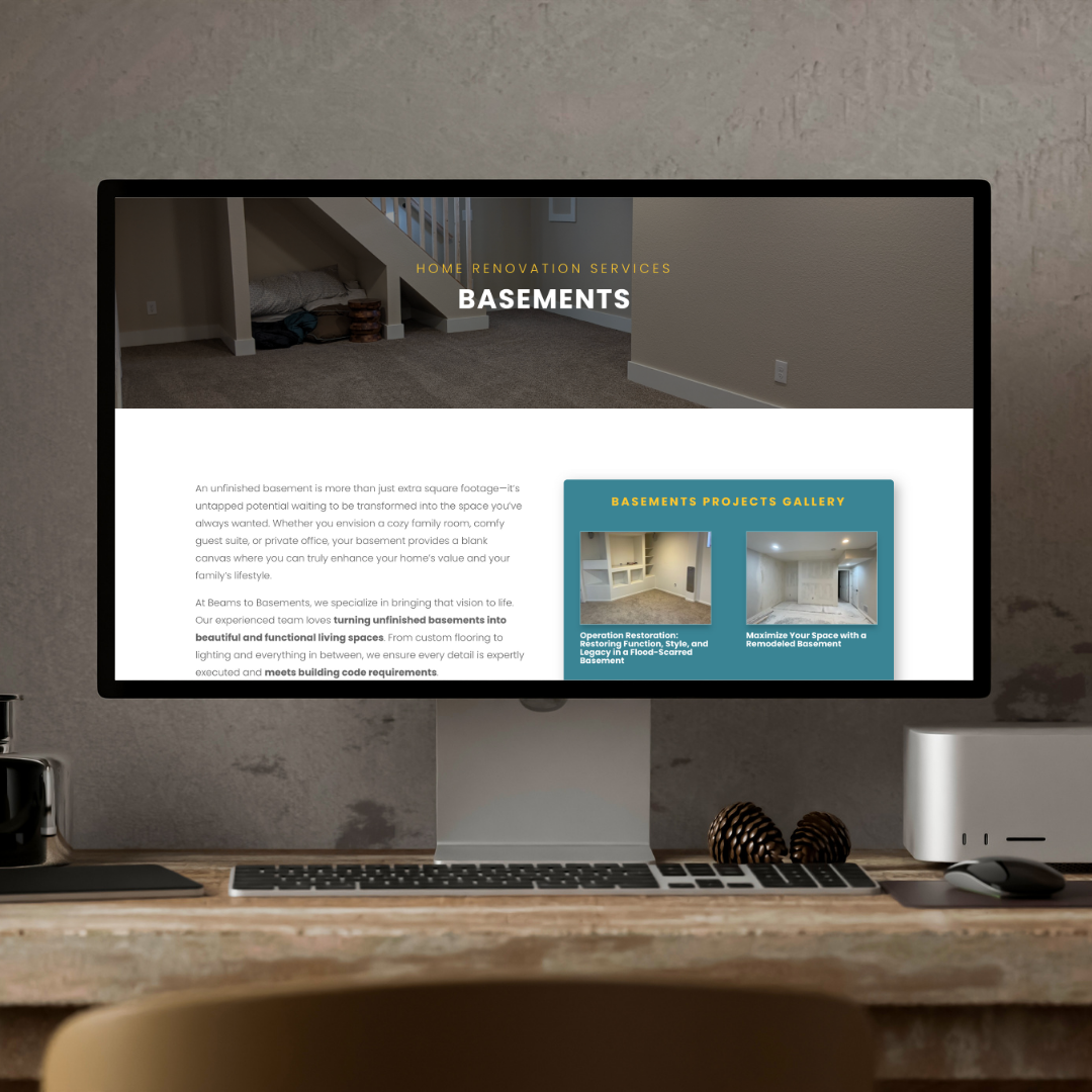 intraMuse Creative - Website Design Desktop computer displaying the Beams to Basements basement renovation services webpage, with a clean, modern home office setup.